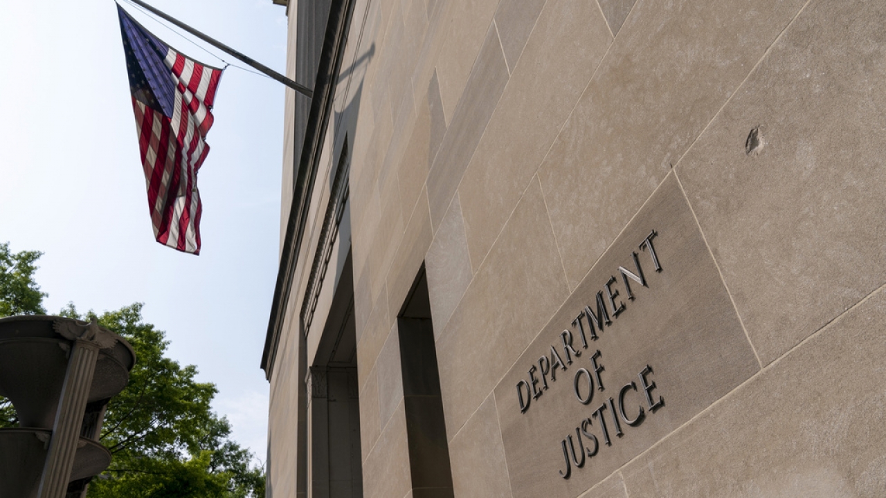 The Department of Justice building is shown.