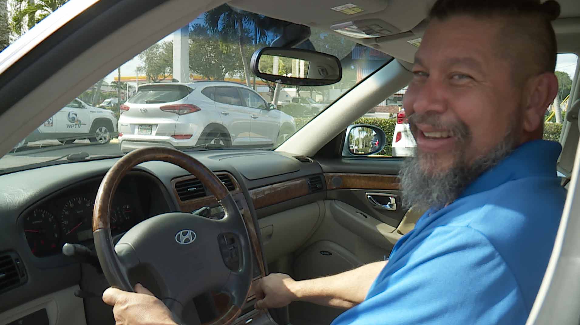 George Morales starts up his car after receiving it courtesy of an anonymous donor.