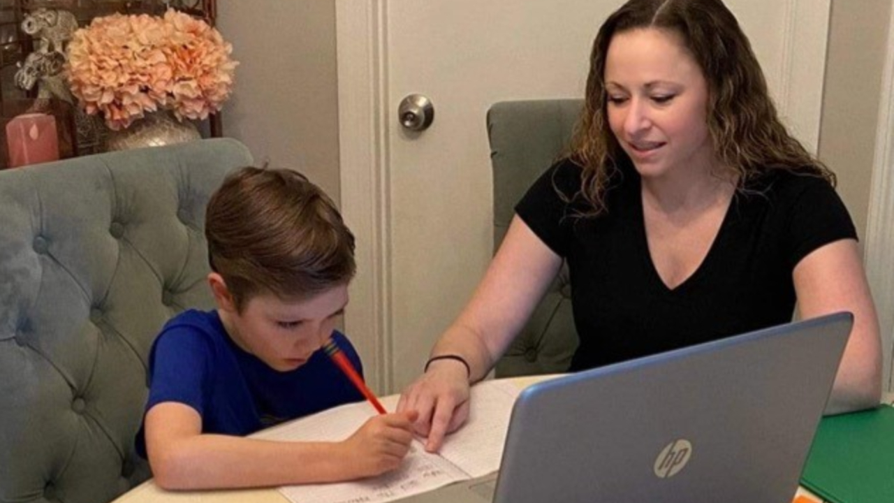 Palm Beach County mother Leah McIntyre helps her son, Ryan, with distance learning during the 2020-21 school year.jpg