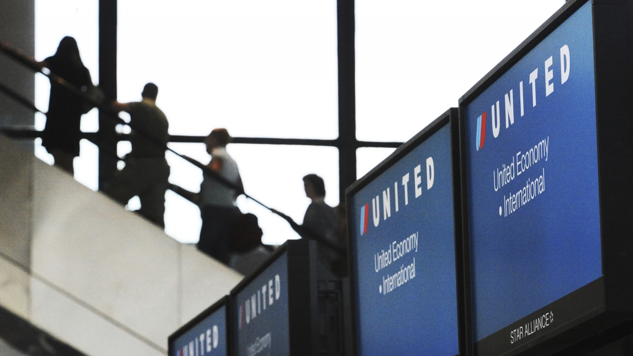 Passengers make their way through Logan International Airport.