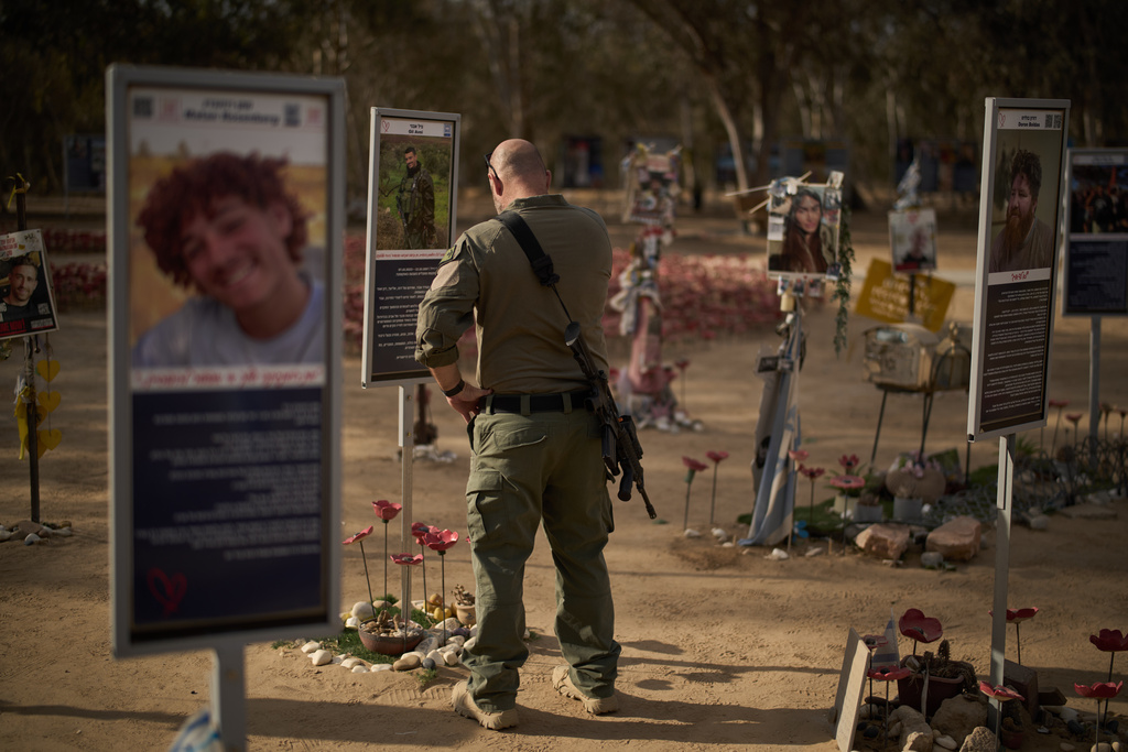 An Israeli soldier visits the site where revellers were killed and kidnapped on Oct. 7, 2023, cross-border attack by Hamas militants at the Nova music festival near the Kibbutz Reim, southern Israel.