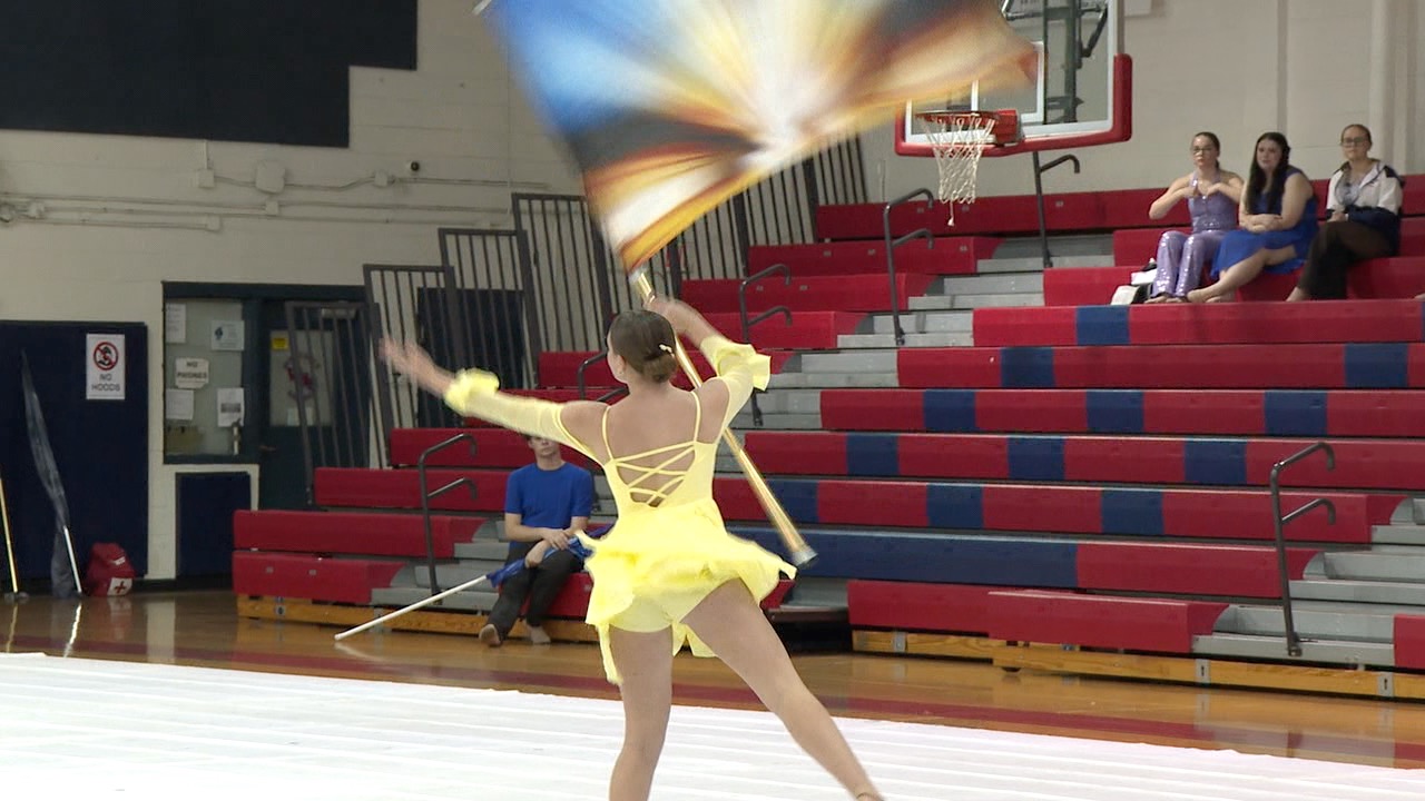 WHS Winter Guard member performing a solo