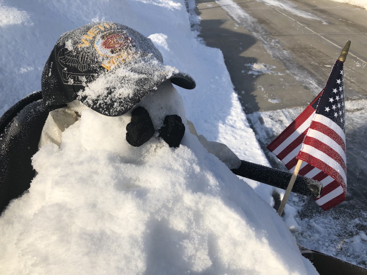 snowman of disabled vet holding US flag
