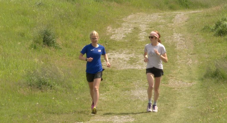 Lauren Bissen (Left) and Sam Avery running through Herron Park, Kalispell, Tuesday, June 9, 2026