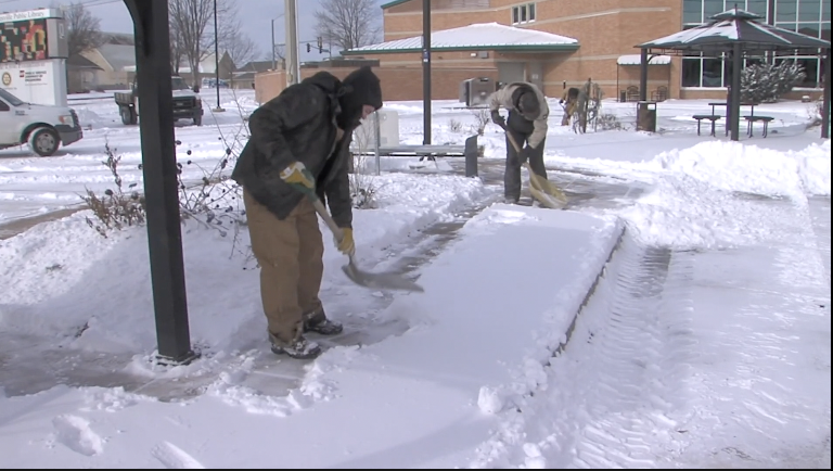 People shoveling snow in extreme cold in Bartlesville 