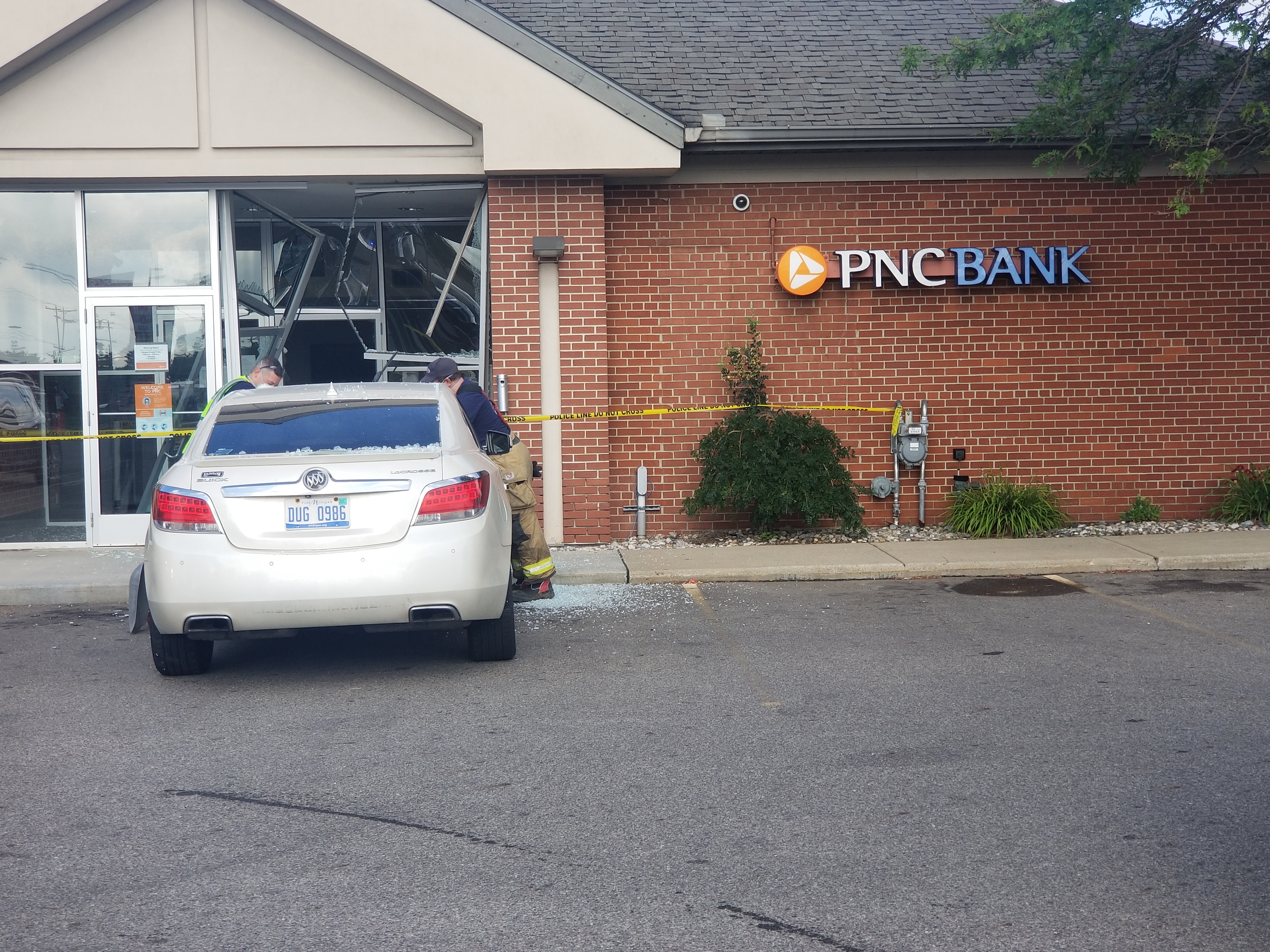 Car drives into front of bank