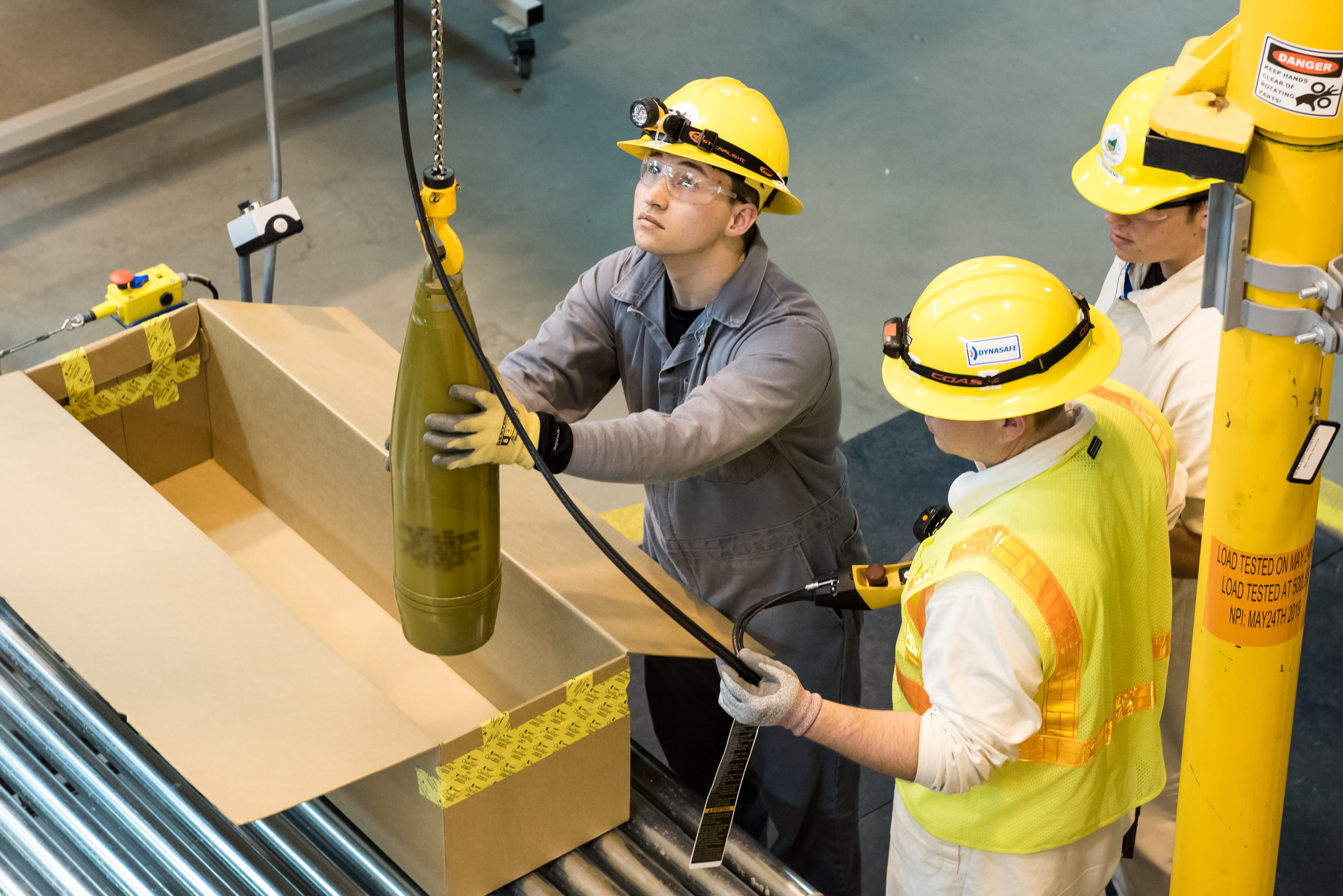4_BG_SDC Worker Loads Projectile.jpg