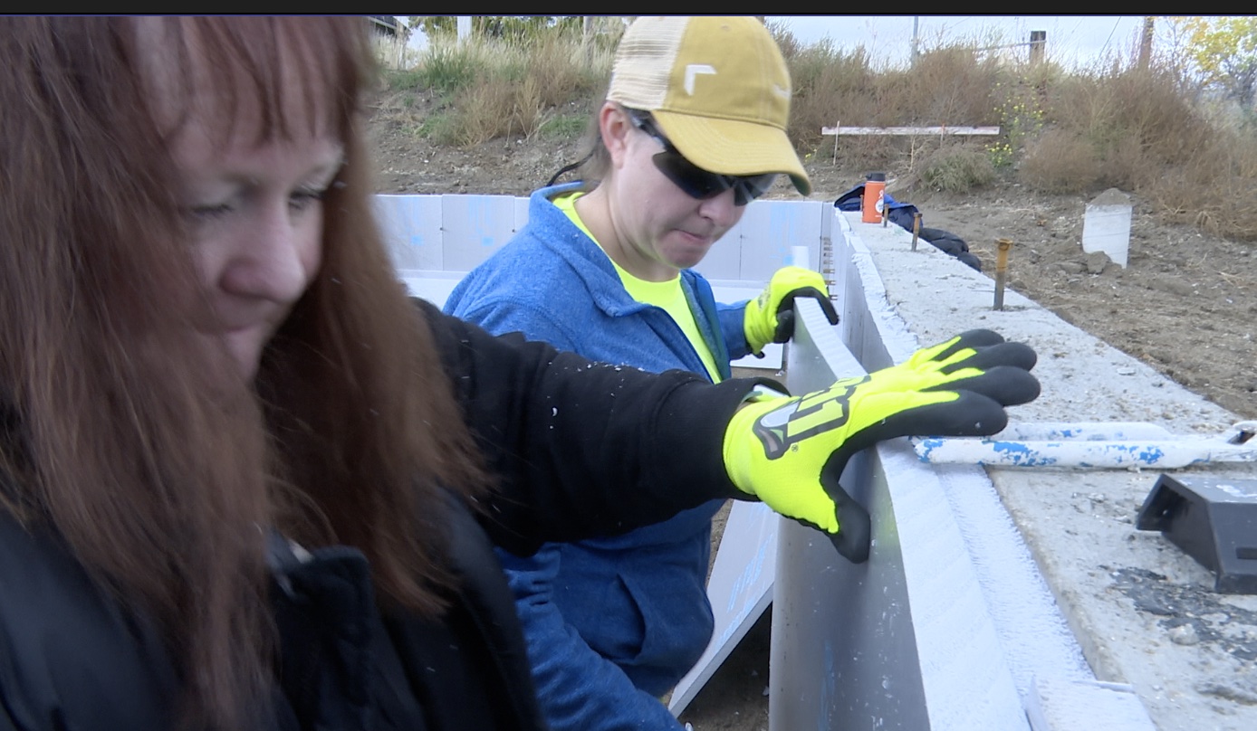 Northwestern Energy volunteers install insulation for Habitat homes - Vimarsana News