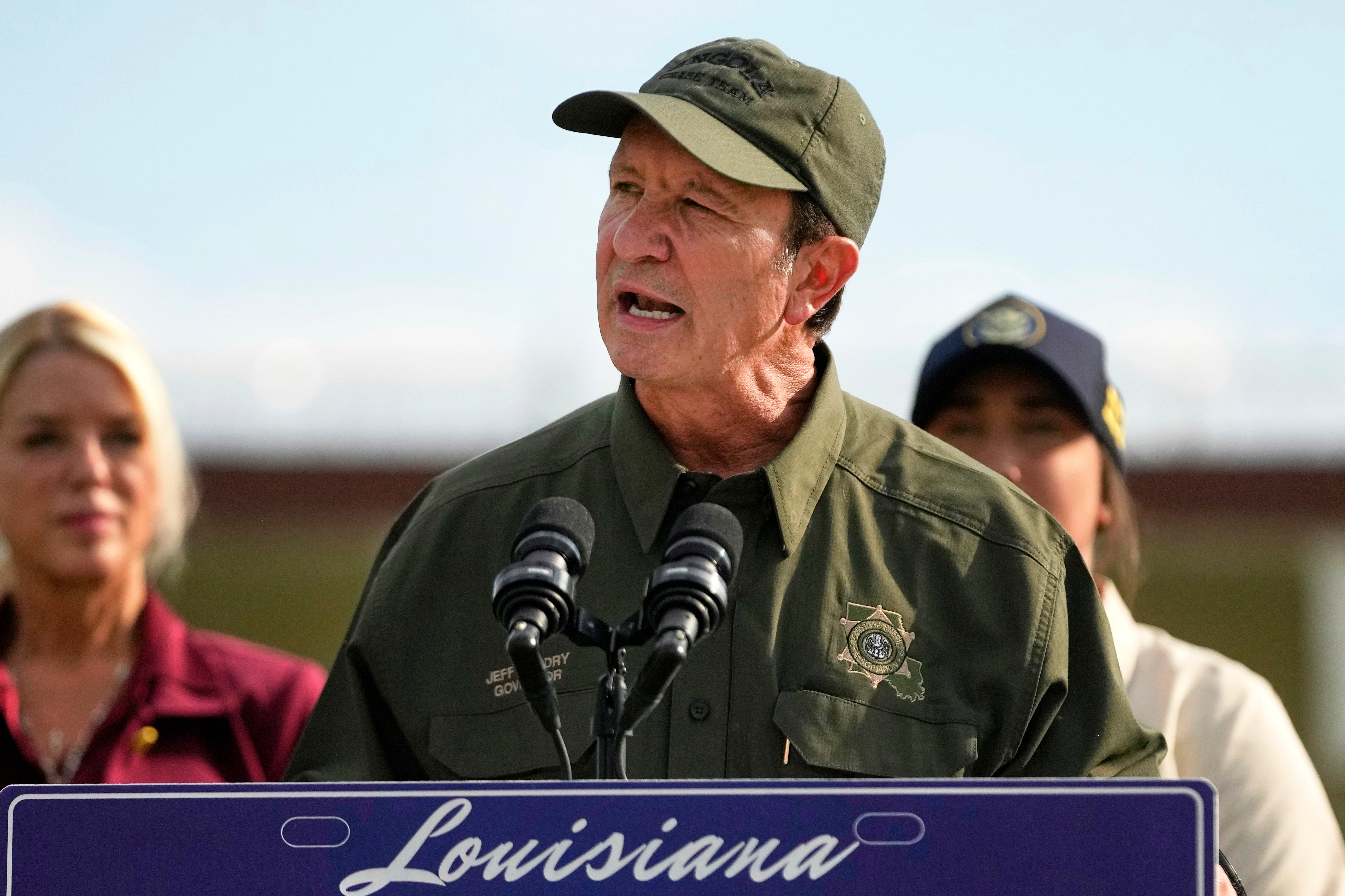 FILE - Louisiana Gov. Jeff Landry speaks to reporters outside "Camp 57," a facility to house immigration detainees at the Louisiana State Penitentiary in Angola, La., Wednesday, Sept. 3, 2025.