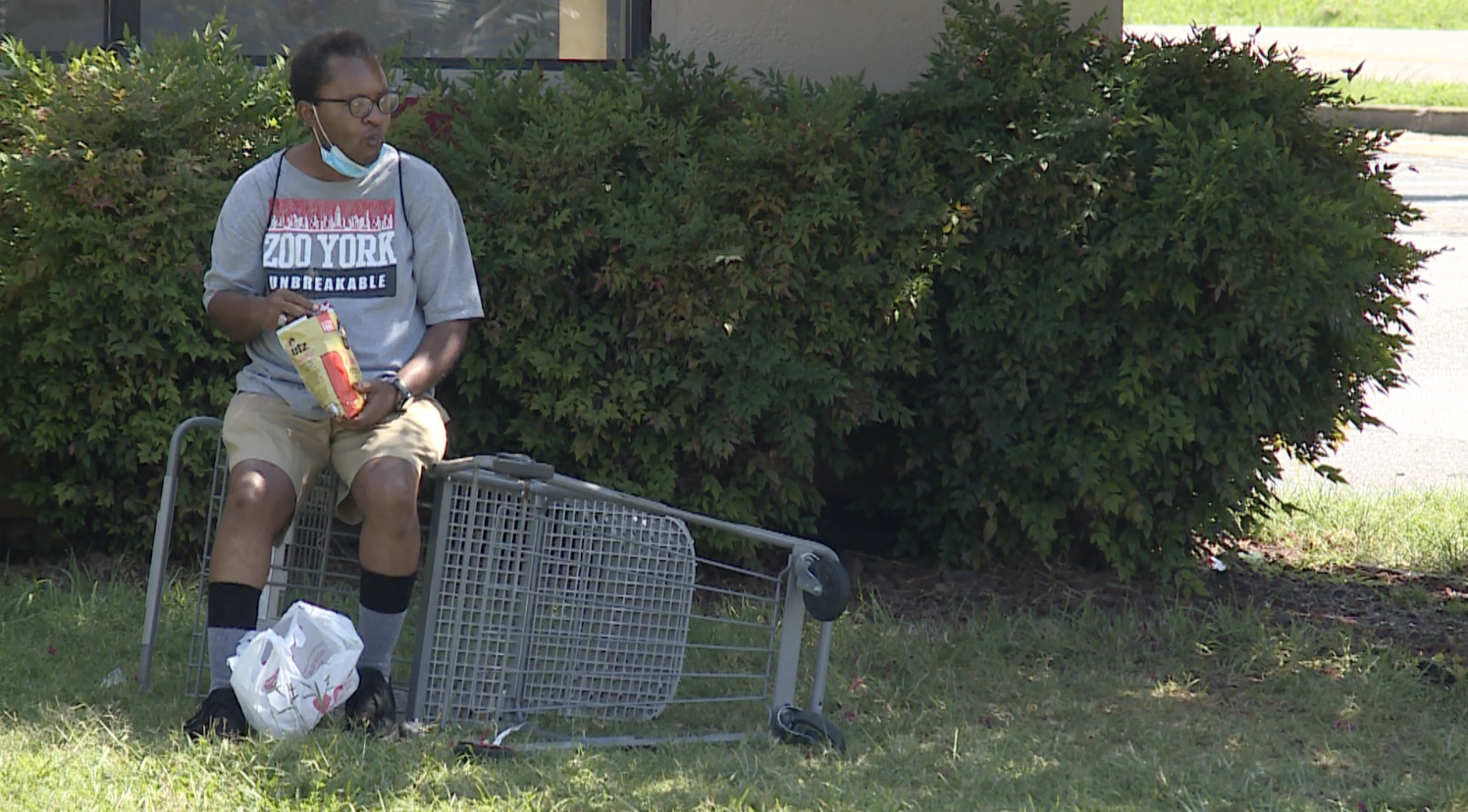 GRTC bus rider sits on shopping cart