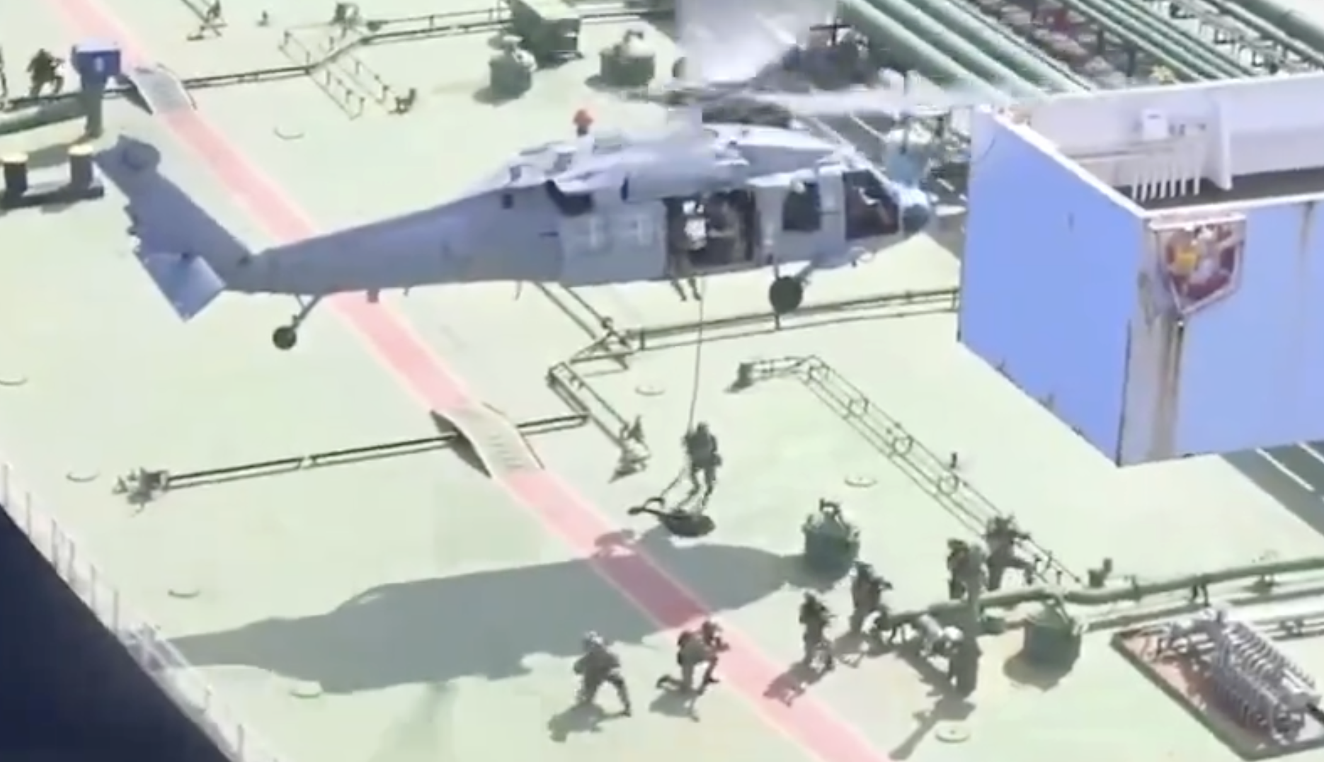 U.S. forces board a ship in the Indian Ocean. 